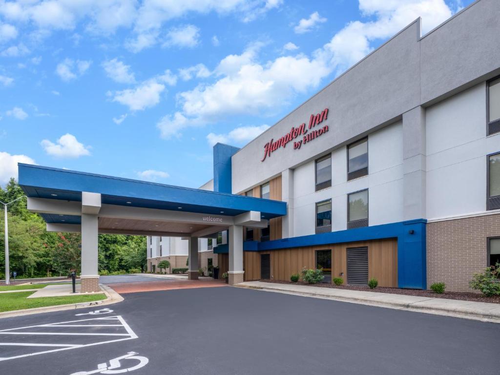 a rendering of a hospital building with a parking lot at Hampton Inn Sanford in Sanford
