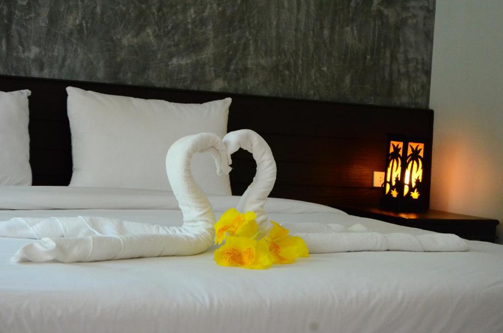 Postel nebo postele na pokoji v ubytování Khaolak Suthawan Resort - SHA Plus