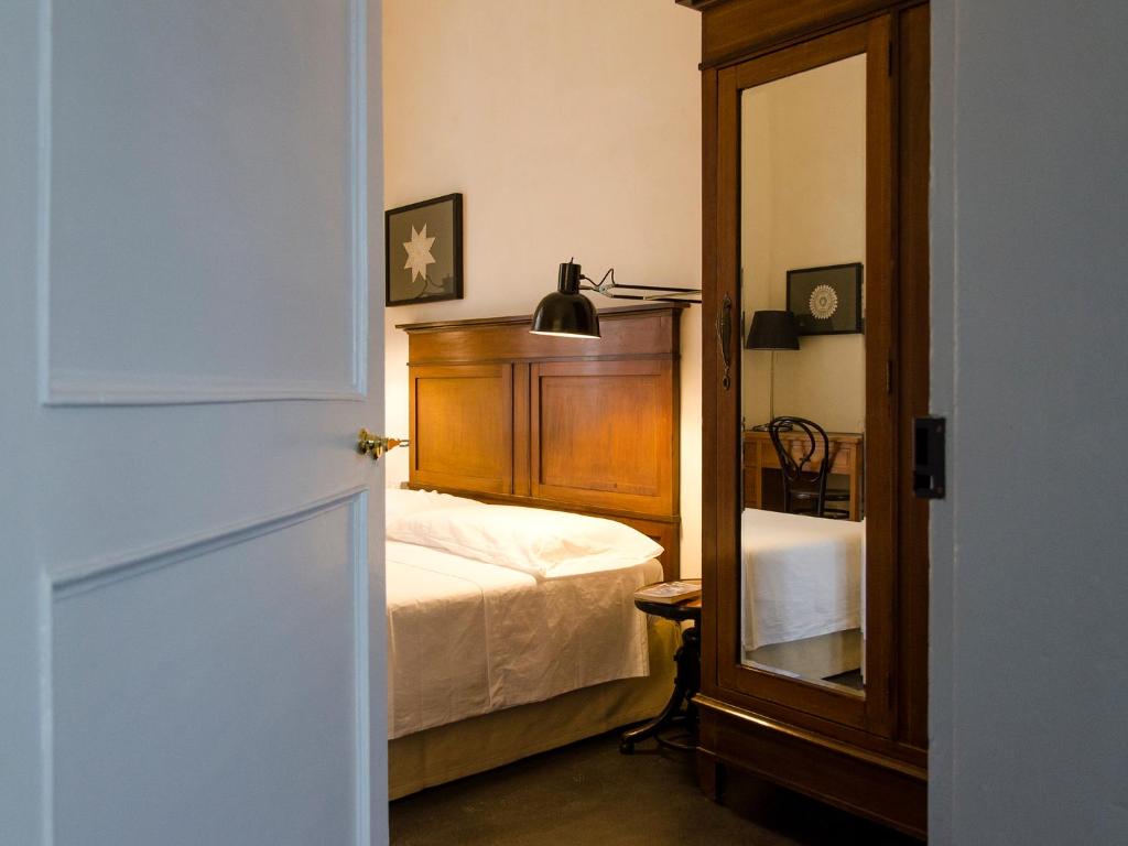 Postel nebo postele na pokoji v ubytování Palazzo Melfi