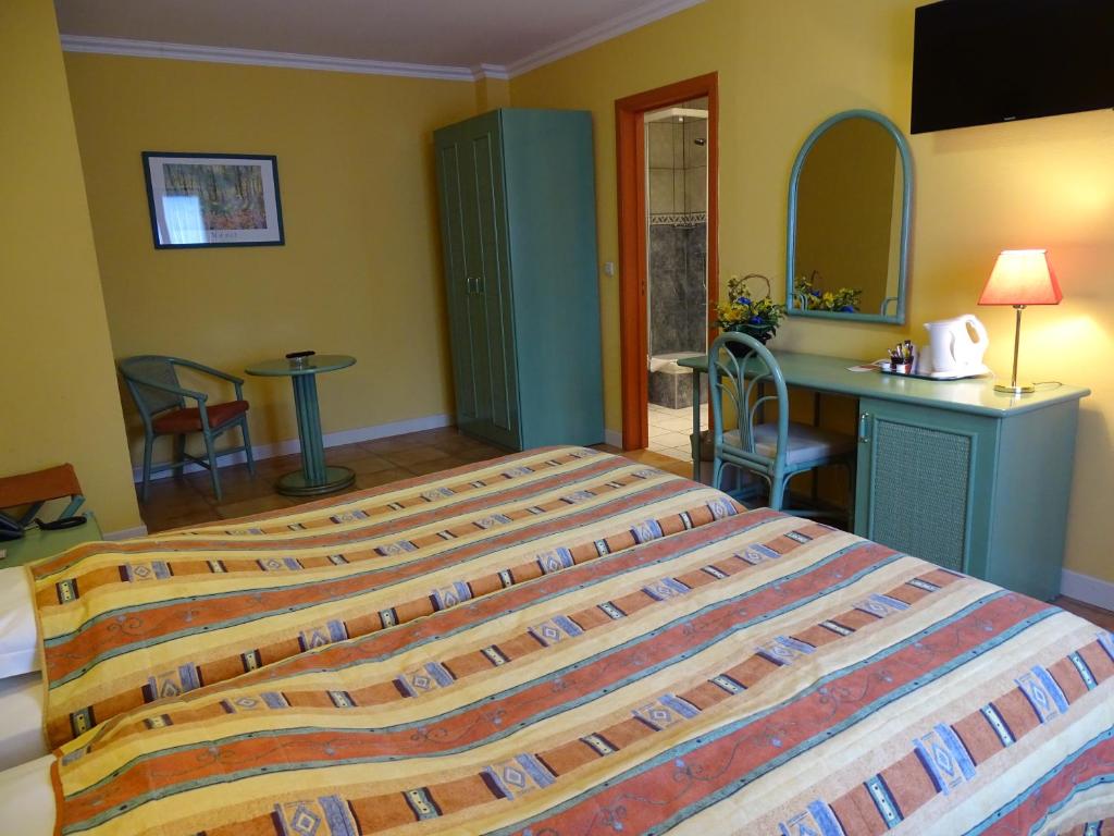 Postel nebo postele na pokoji v ubytování Hotel Le Relais de Pommard