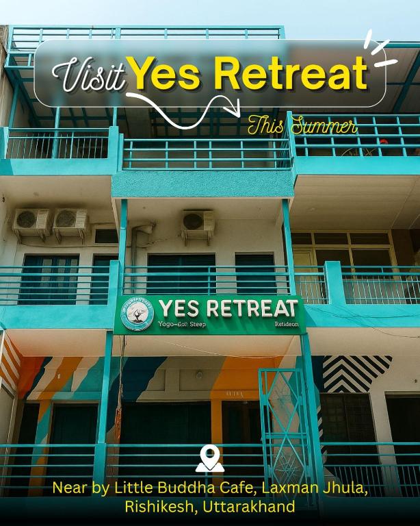 a building with a visit yes retreat sign on it at Yes Retreat Rishikesh in Rishīkesh