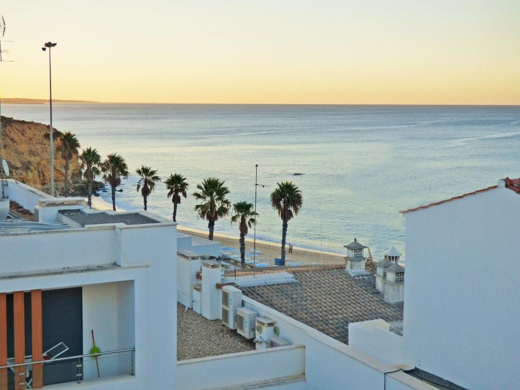 a view of the ocean from a building at Apartamento Olhos D'Água in Albufeira