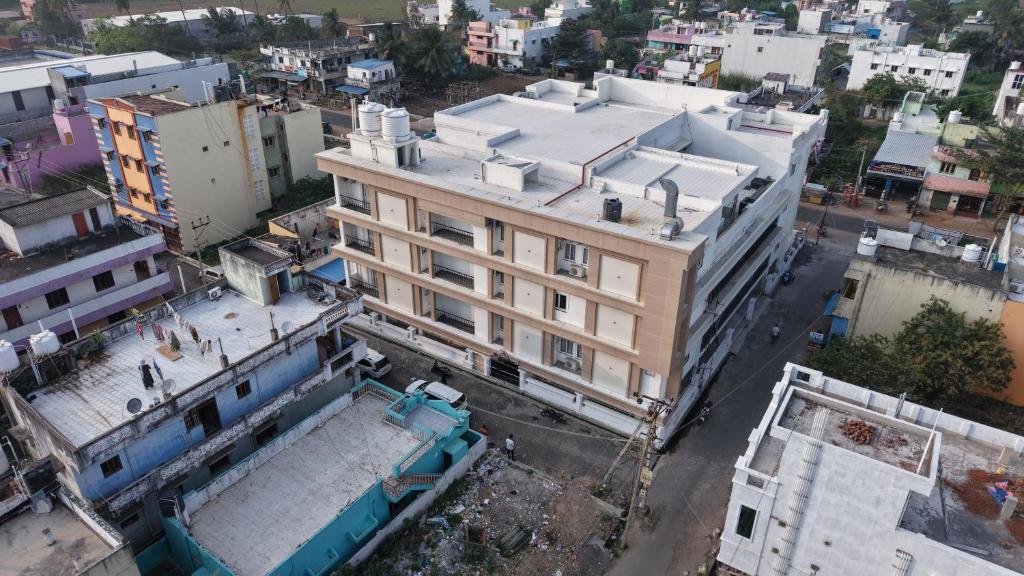 an overhead view of a building in a city at Le Sea Sun in Pūrnānkuppam