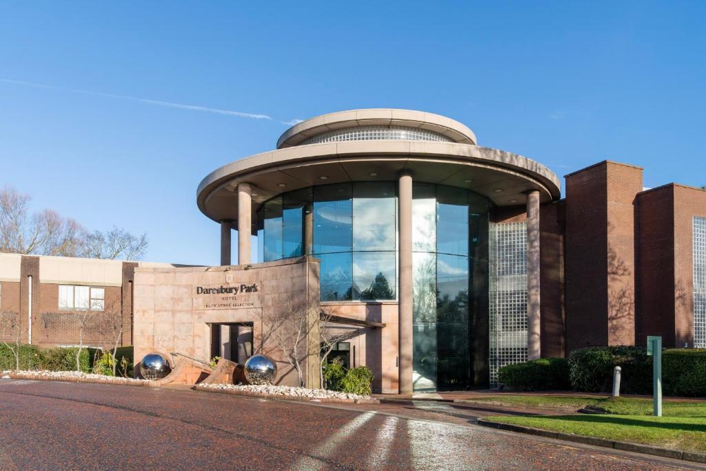 a building with a dome on top of it at Daresbury Park Hotel in Daresbury