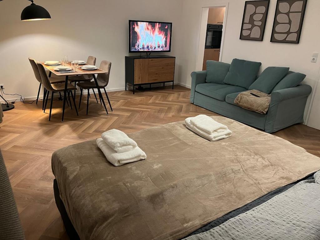 a living room with a couch and a table at Triberg City Apartment 1 in Triberg