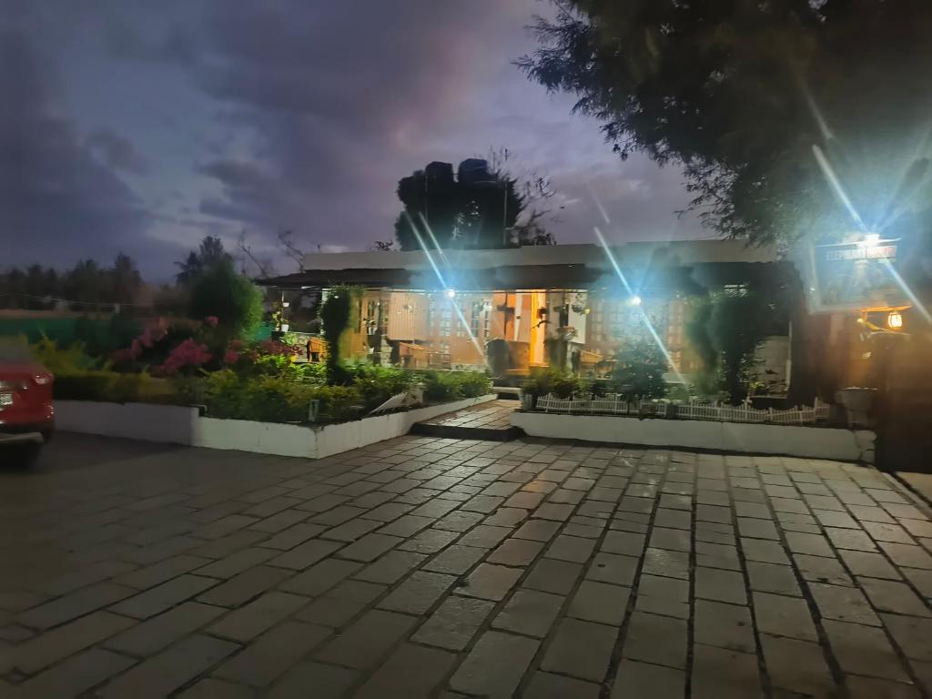 a house at night with lights on at Elephant County Resort in Masinagudi