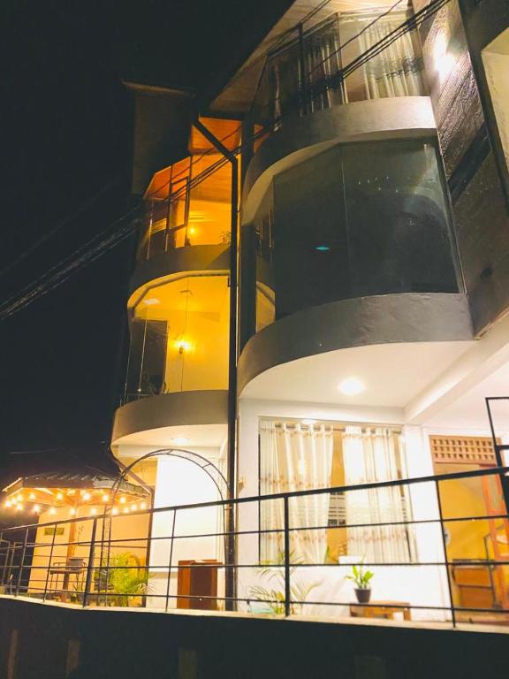 a balcony on a cruise ship at night at Niwasa Hills in Nuwara Eliya