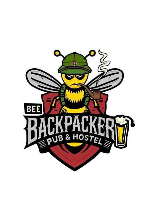 a bee with a hat and a mug of beer at Bee Backpackers Hostel in Quang Binh