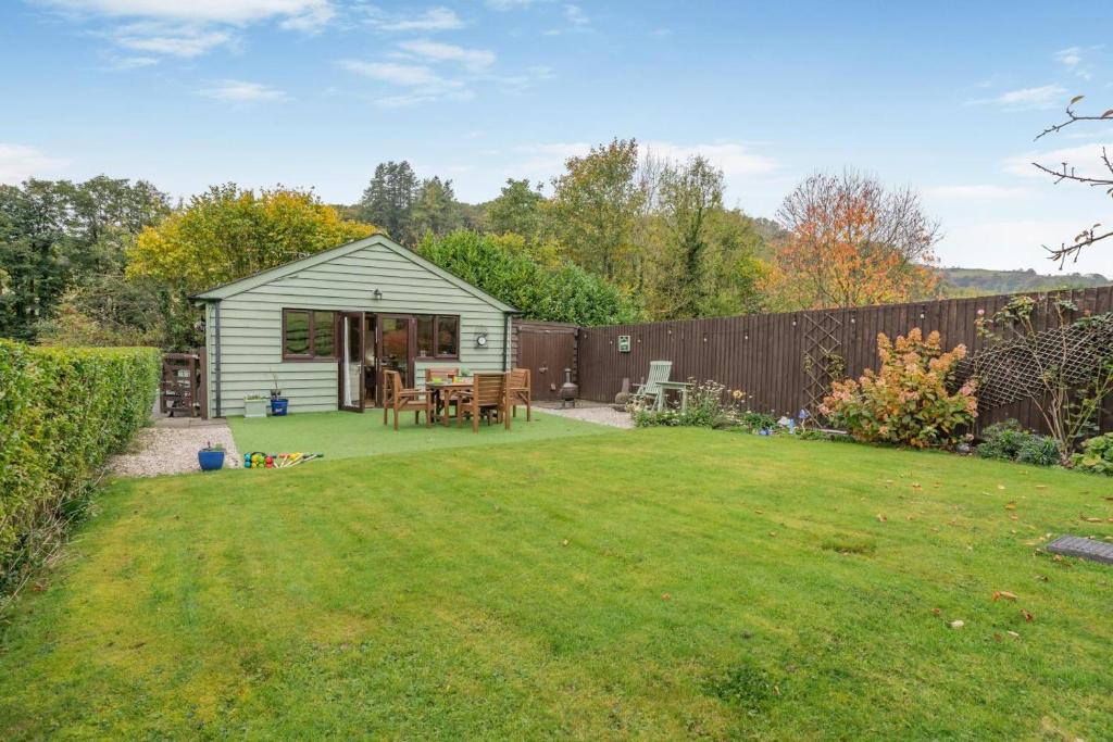 a backyard with a shed and a fence at 2 Bed in Brecon oc-r33603 in Lower Chapel