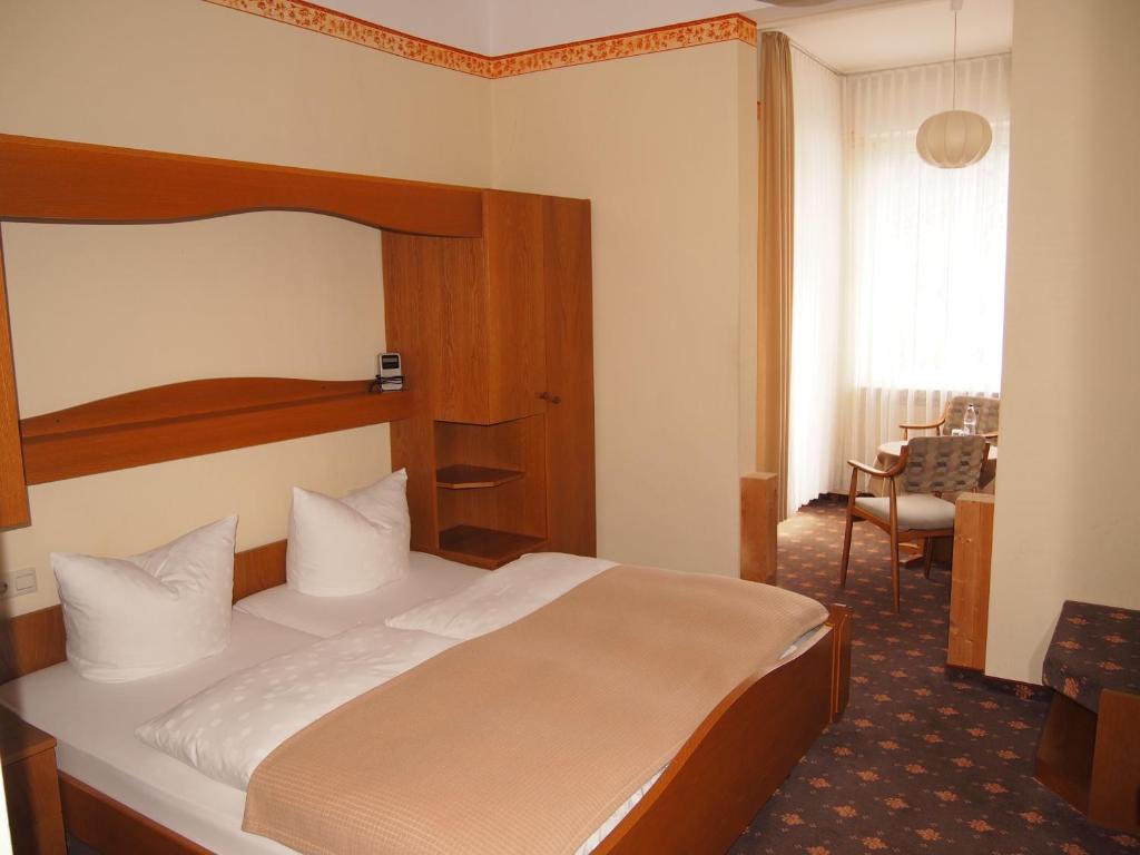 Postel nebo postele na pokoji v ubytování Hotel Fidelitas