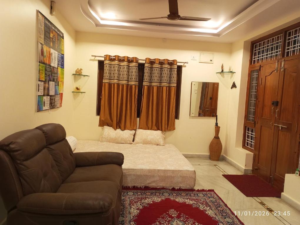 a living room with a couch and a couch and a chair at EnDai House - Kalyanpuri, Uppal in Hyderabad