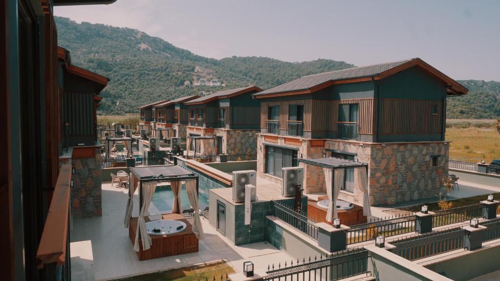 arial view of a row of houses with mountains in the background at champion villas in Ortaca
