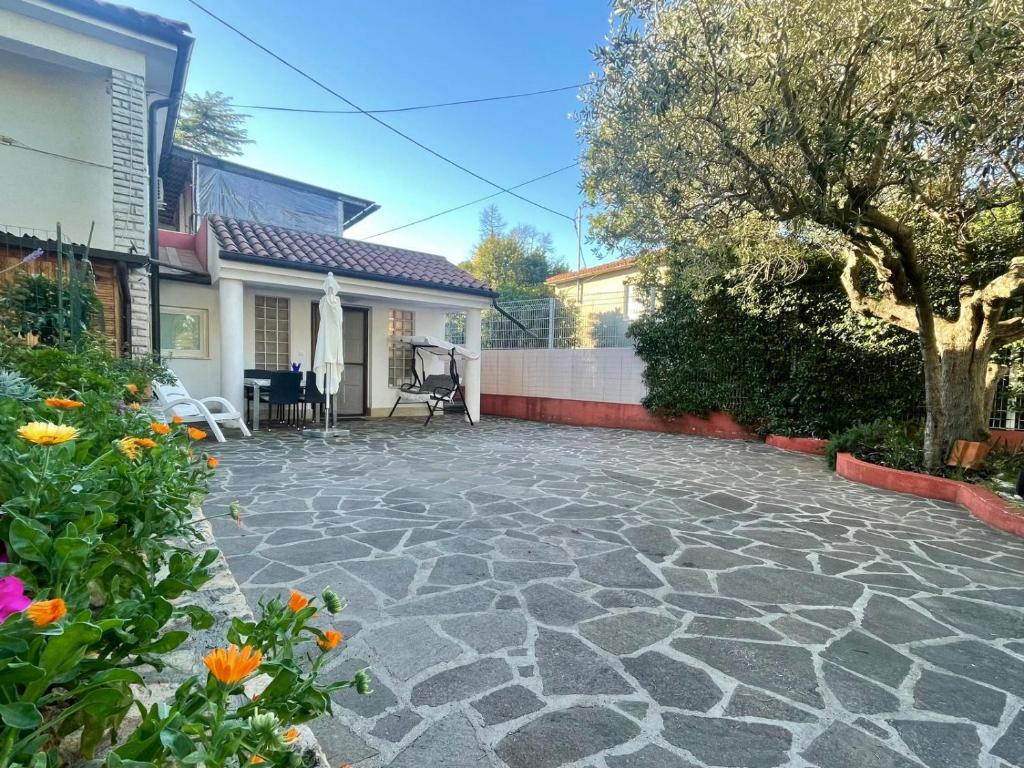 a stone patio in front of a house at Bungalow Punta in Umag