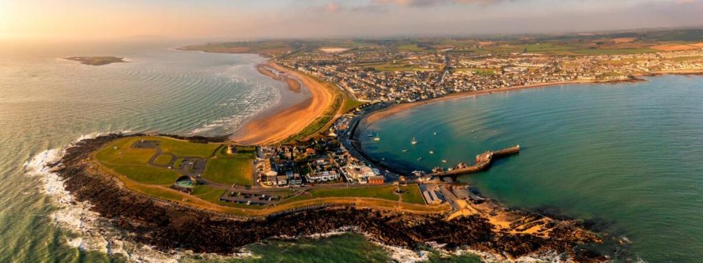 an aerial view of a beach and the ocean at The Anchor in Skerries