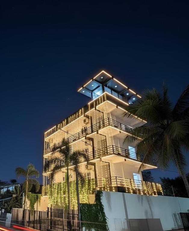 a building with lights on top of it at night at City Hotel Thalawathugoda in Talawatugoda