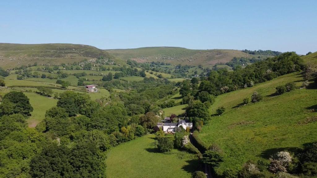 an aerial view of a house on a hill at Black Mountains Stylish Hideaway, nr Crickhowell in Llanbedr