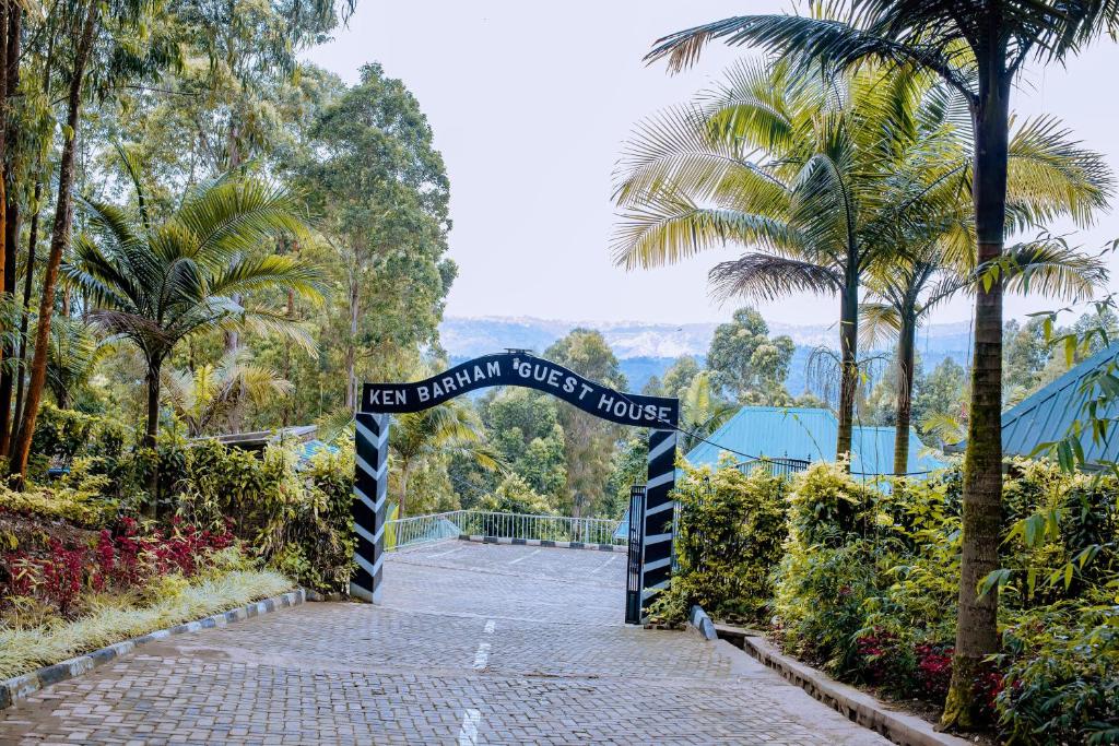 a gate at the entrance to a mountain forest house at EAR KEN BARHAM GUESTHOUSE in Rwumba