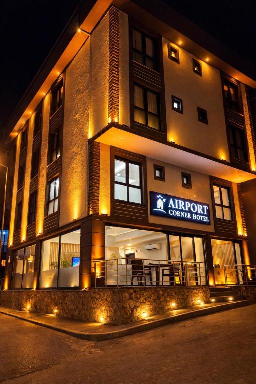a building with a sign on the front of it at Airport Corner Hotel in Trabzon