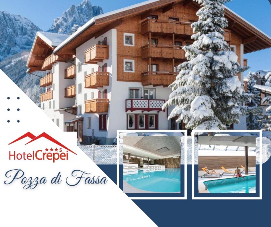 a resort in the mountains with a pool and a christmas tree at Hotel Crepei in Pozza di Fassa