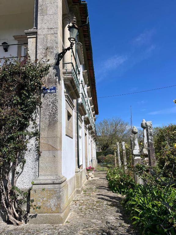 a building with a street light on the side of it at Casa da Freiria in Ponte de Lima