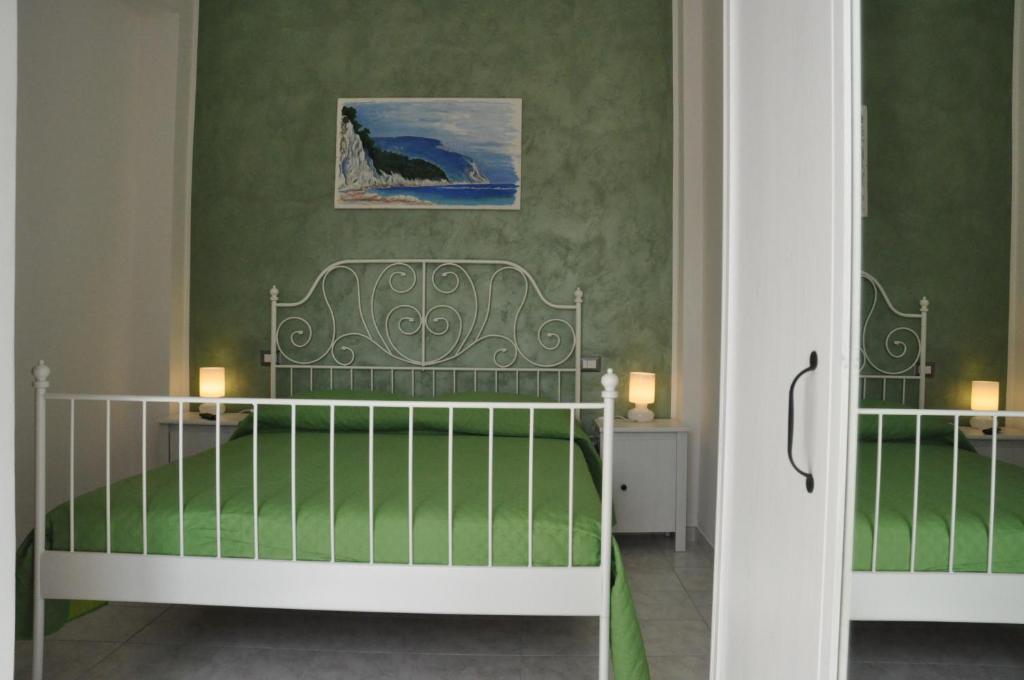 Postel nebo postele na pokoji v ubytování Bed and Breakfast Sara Mare