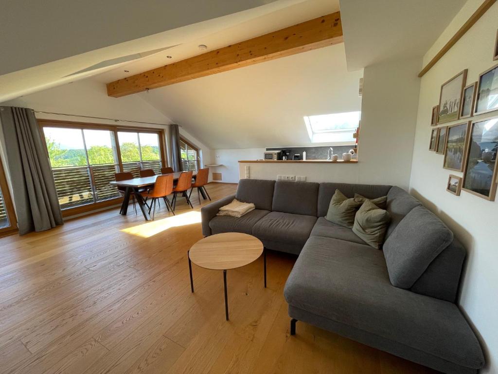a living room with a couch and a table at Lapperhof in Waging am See
