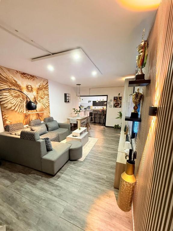 a living room with a couch and a table at Fairyland room in Port Louis