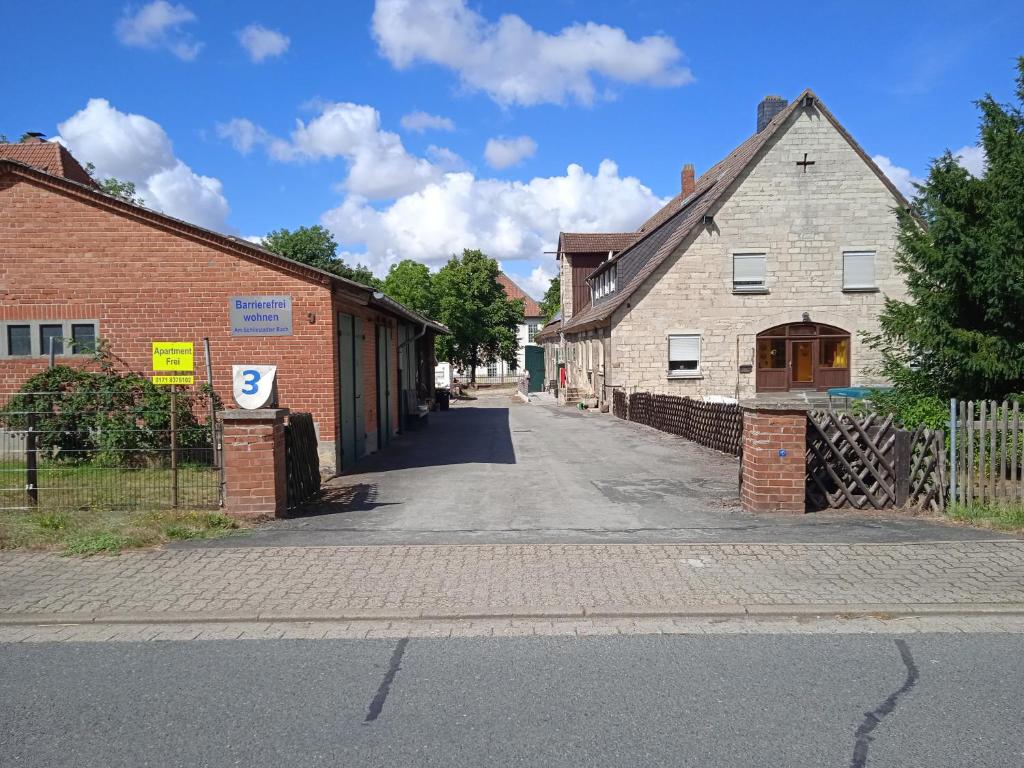 an empty street in a small town with buildings at Wohnen am Schliestedter Bach b in Schöppenstedt