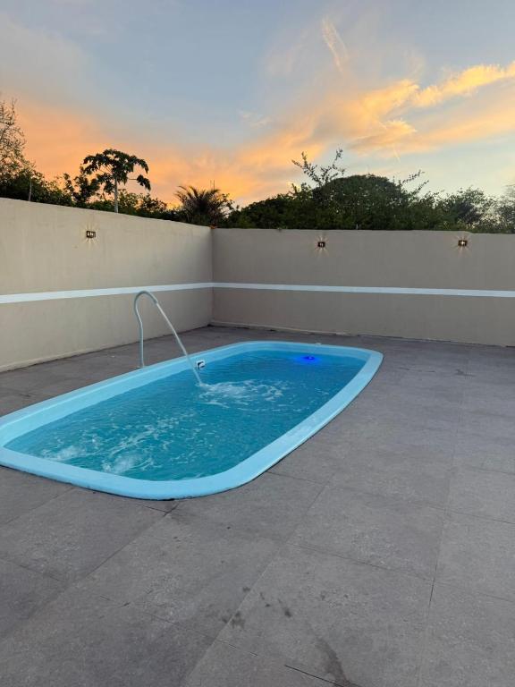 a large blue bath tub sitting on a patio at Edilson santos in João Pessoa