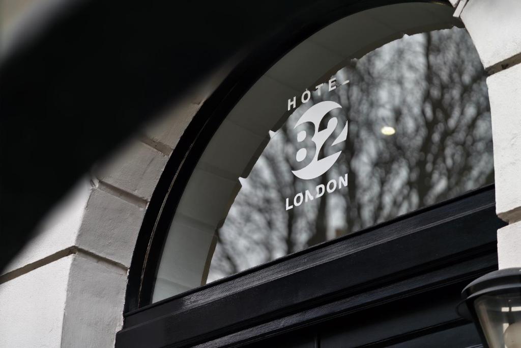 a window of a building with the number on it at MSK Hotel 82 in London
