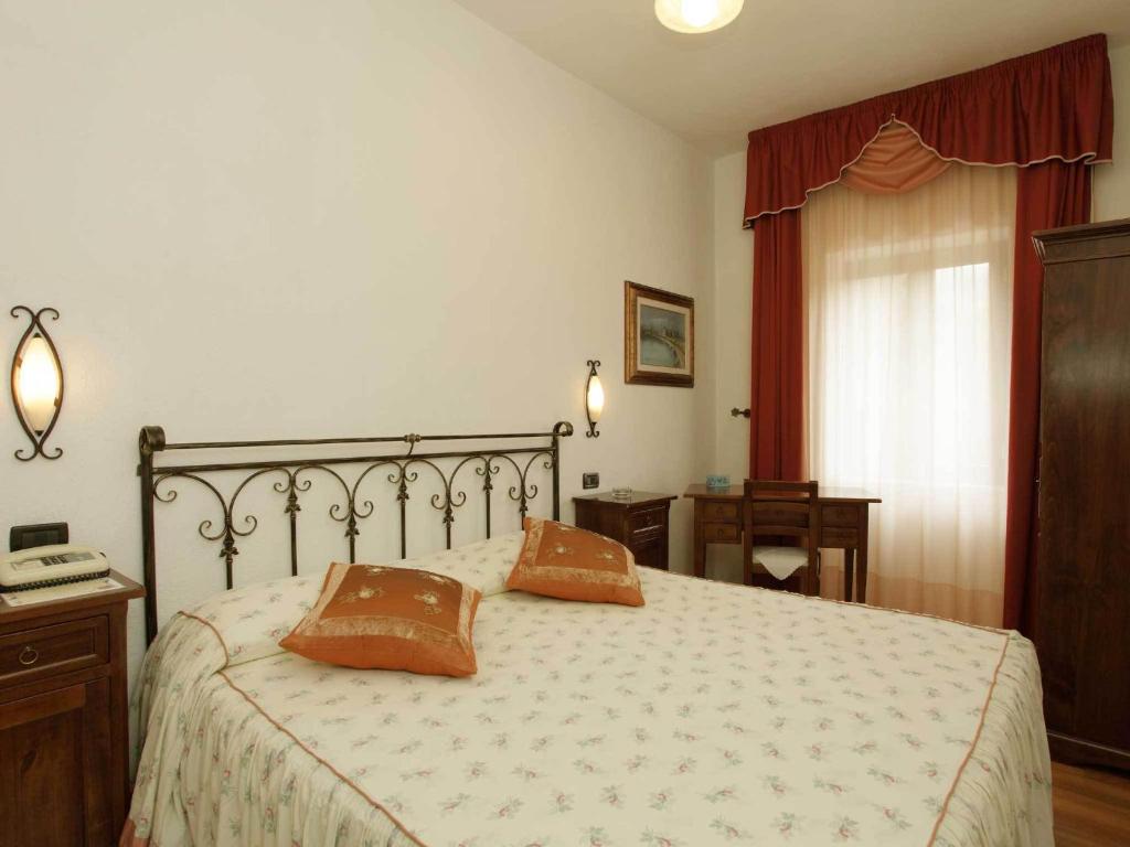 Postel nebo postele na pokoji v ubytování Albergo Le Macinaie - Monte Amiata