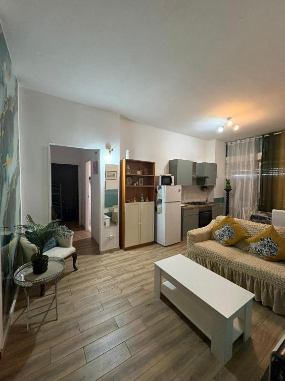 a living room with a couch and a table at B&B MaKri in Boltiere