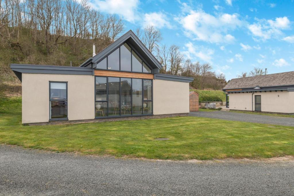 a house with a lot of windows at 3 Bed in Bamburgh oc-w31886 in Bamburgh