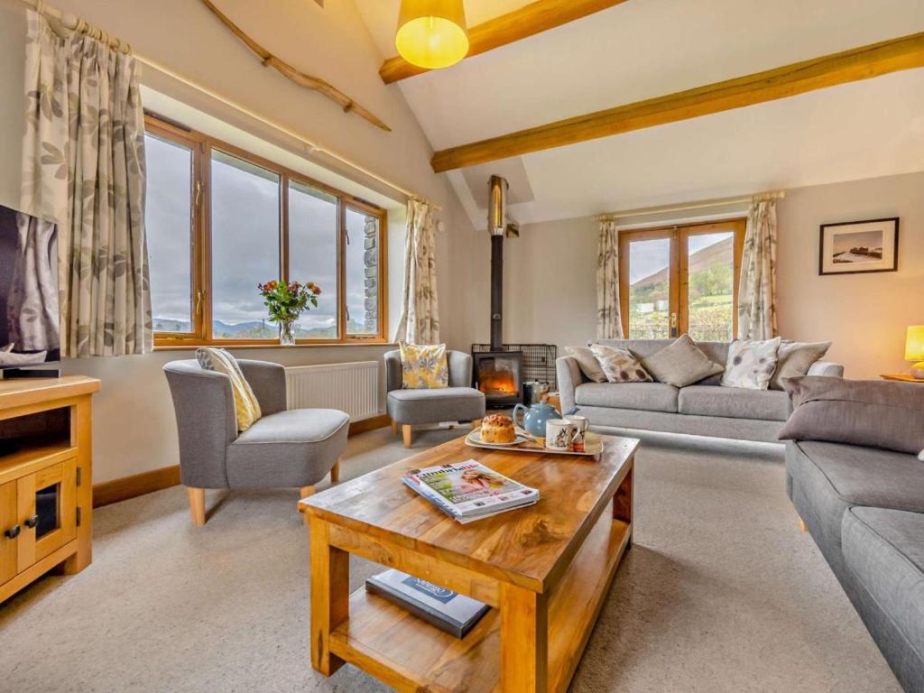 a living room with a couch and a table at 3 Bed in Keswick oc-93590 in Threlkeld