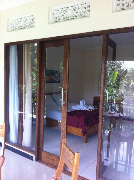 Postel nebo postele na pokoji v ubytování Pondok Bali