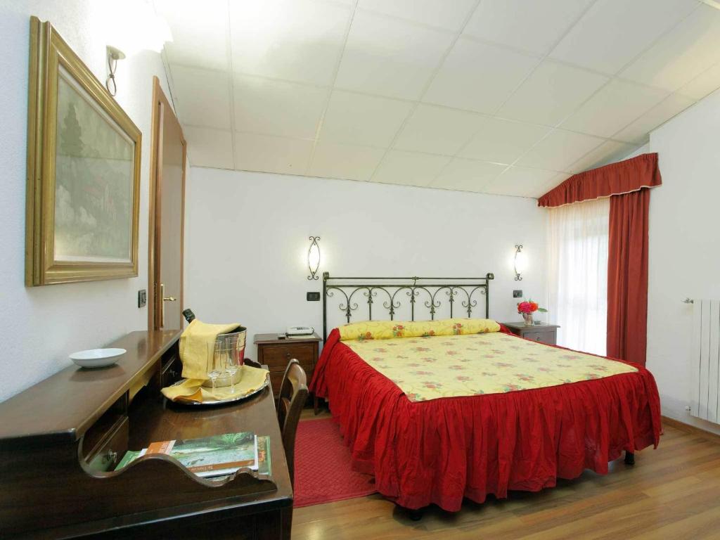 Postel nebo postele na pokoji v ubytování Albergo Le Macinaie - Monte Amiata