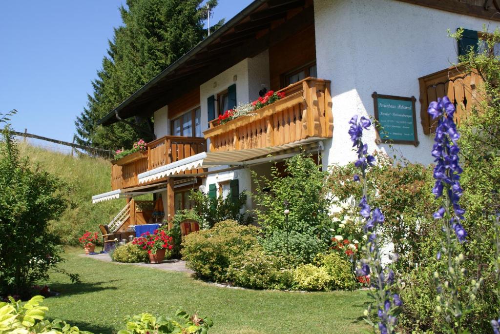 a house with flowers in front of it at Ferienhaus Cosima in Schwangau