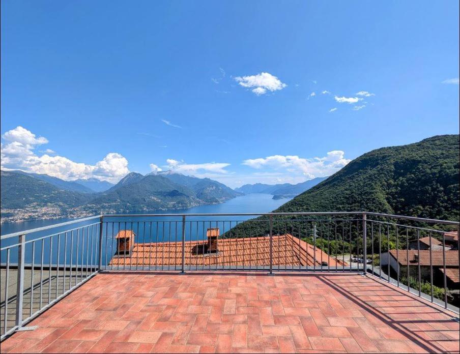 a balcony with a view of the water and mountains at Rooftop Carcente in San Siro