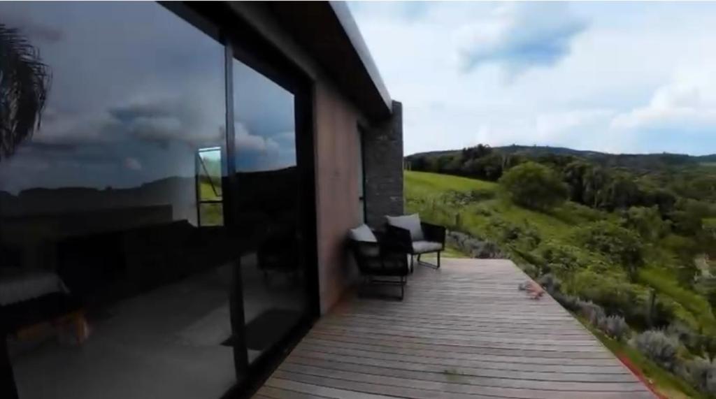 a balcony of a house with a view of the mountains at Le Chateau Lavande in Balsa Nova