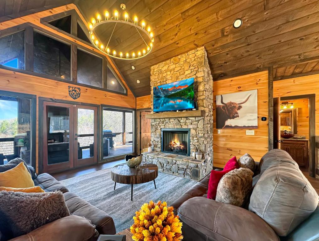 a living room with a couch and a fireplace at 249 Ranger Station in Morganton