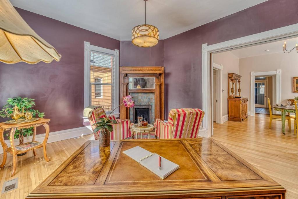 a living room with a table and chairs at Rosemont in Florence
