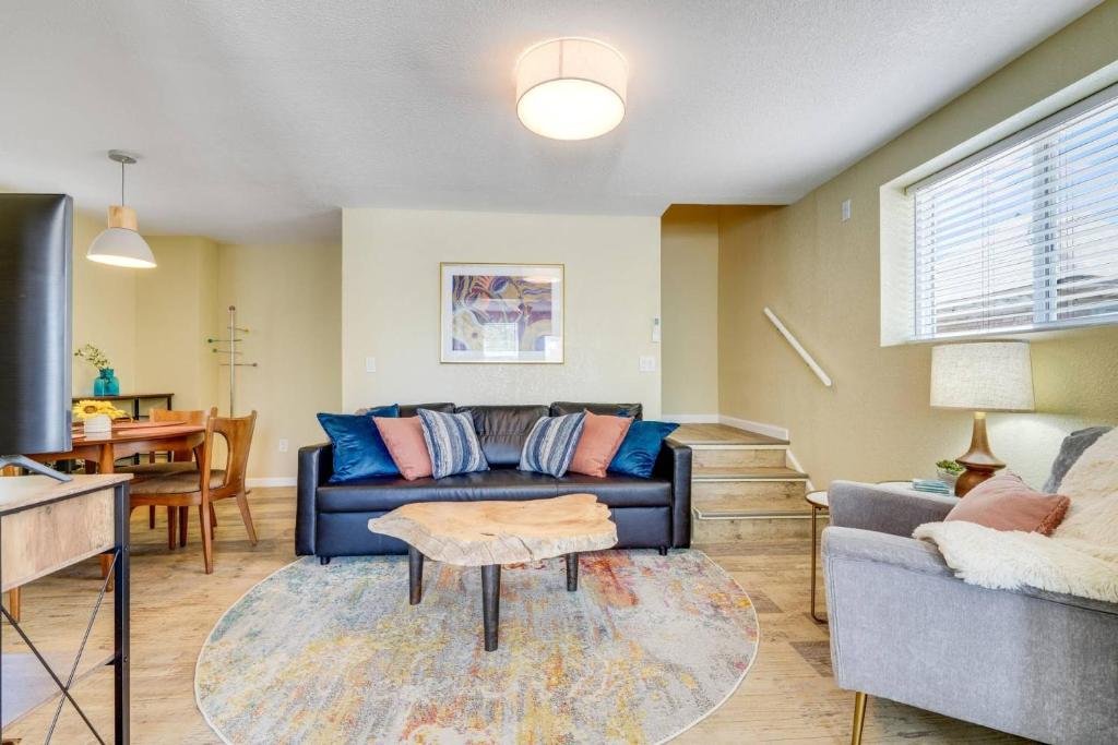 a living room with a couch and a table at Rosemont Cottage in Florence