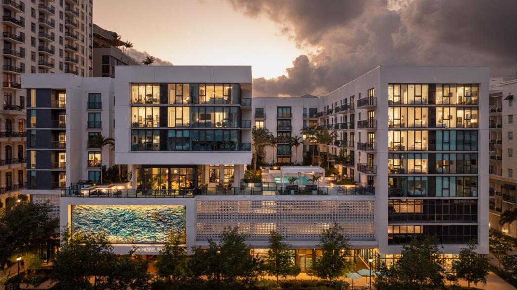 a rendering of an apartment building with a pool at Hotel AKA West Palm in West Palm Beach