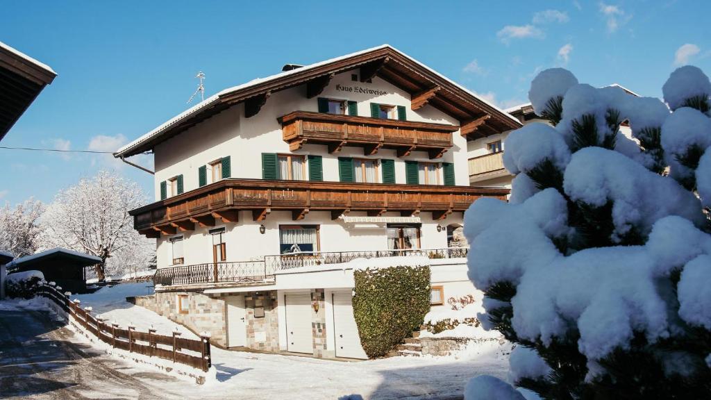 a large building with snow on the ground at Haus Edelweiss in Itter