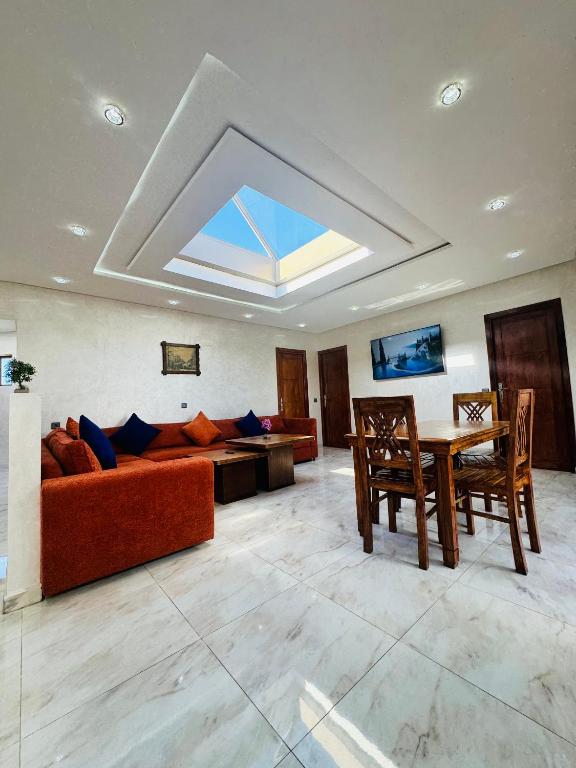 a living room with a couch and a table at The Sun Gate in Agadir