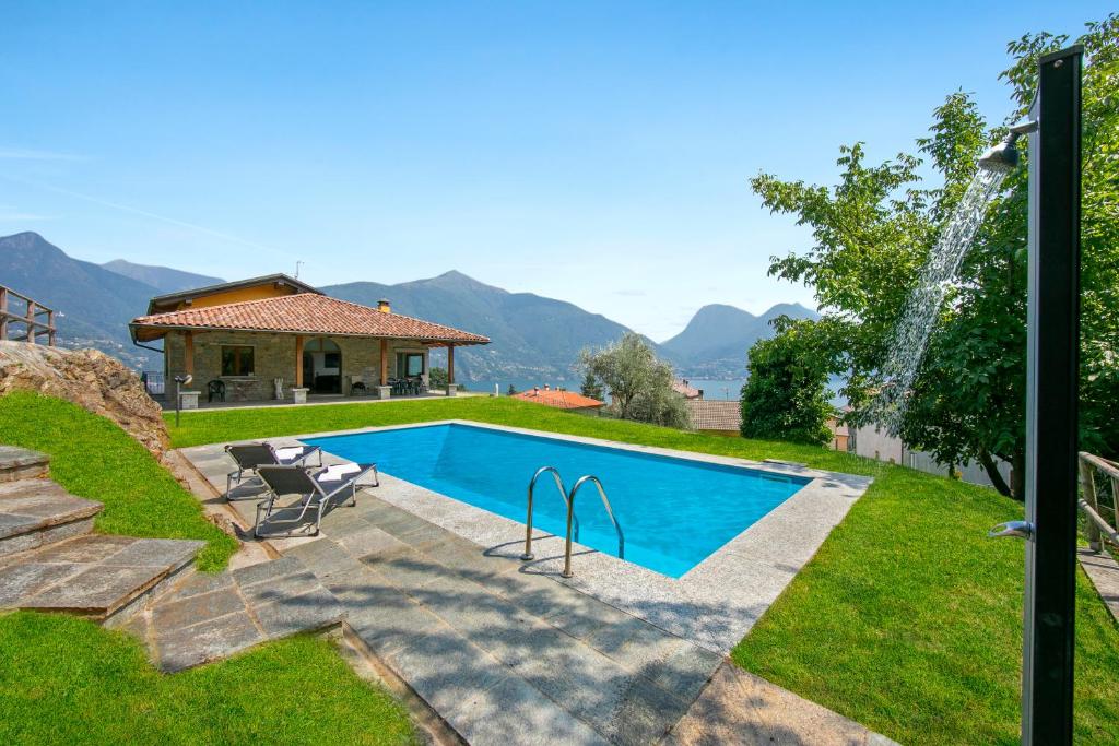 a swimming pool in the backyard of a house at Villa Louise in San Siro