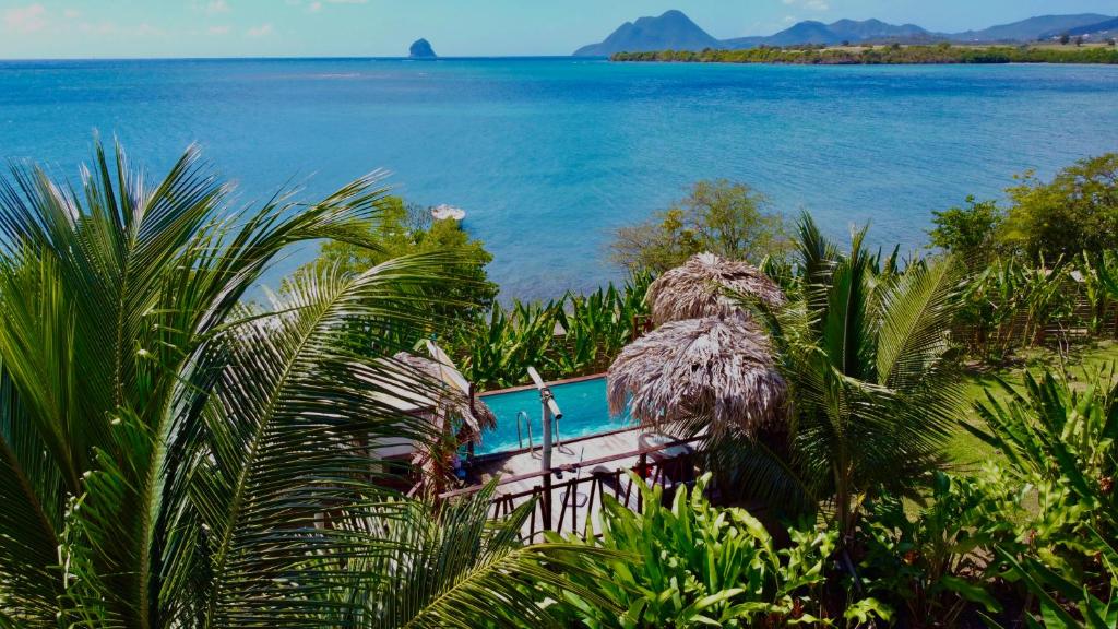a boat in the middle of a body of water at dom nature lodge & spa in Sainte-Luce