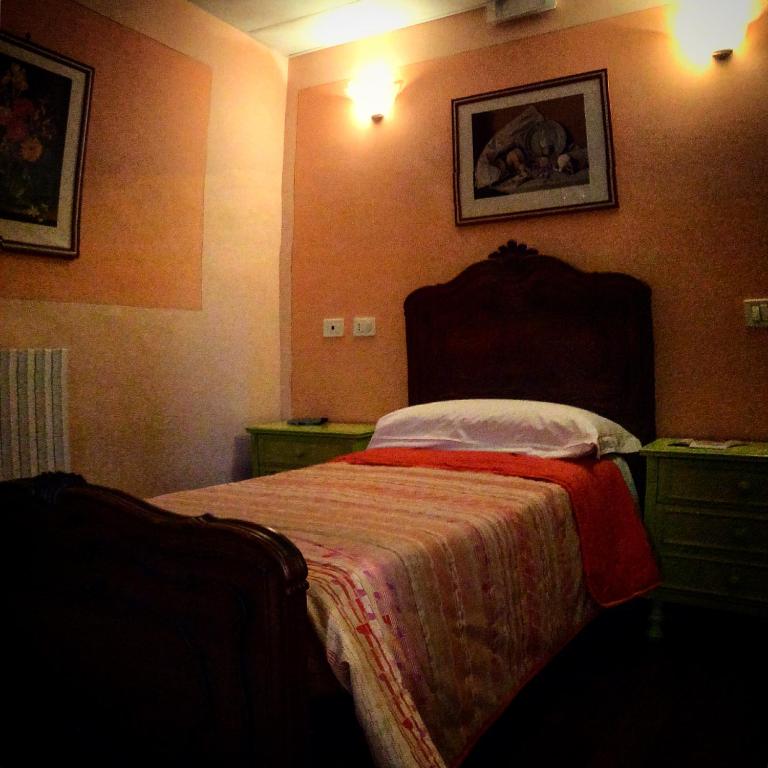 Postel nebo postele na pokoji v ubytování Locanda del Principe