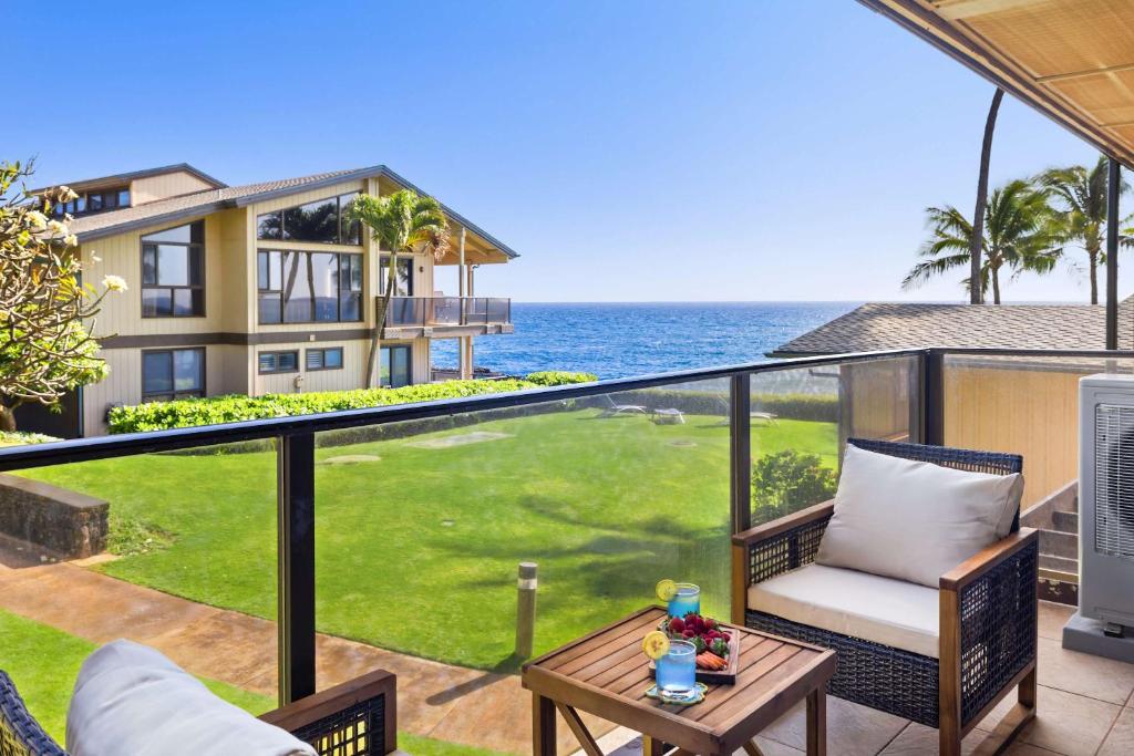 a view of the ocean from the balcony of a house at MA-1205 - Ocean Views AC in Koloa
