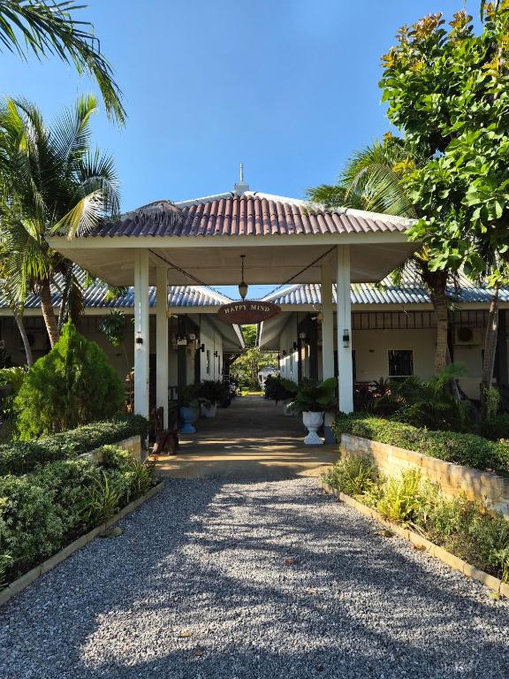 a building with a pavilion with a walkway at Happy Mind Resort in Sam Roi Yot